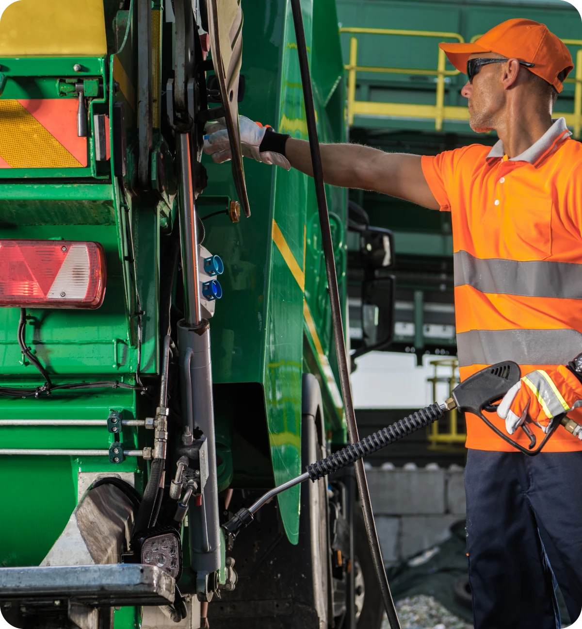 Man managing waste truck machinery